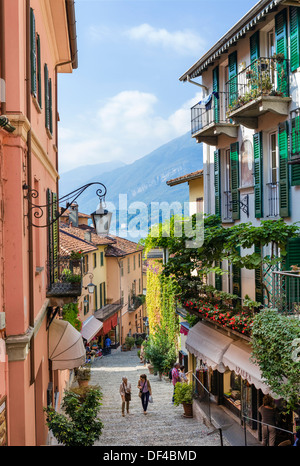 Shops on Salita Serbelloni in the historic old town with the lake in the distance, Bellagio, Lake Como, Lombardy, Italy Stock Photo