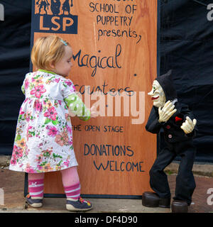 Magicial encounters in Skipton UK. 27th September, 2013. International Puppet Festival. Daisy Le Drew, 1 year old baby from Derby at Skipton's biennial international puppet festival, sideshow featuring puppet theatre control companies from all over Europe. Stock Photo