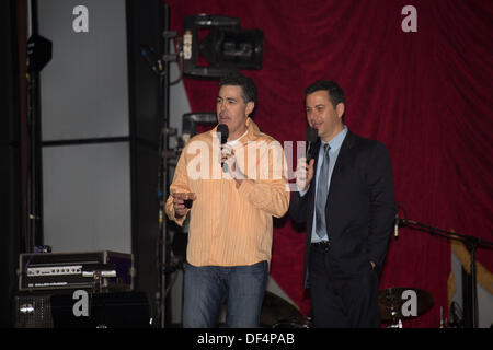 LA, CA, USA. 26th Sept, 2013. Comedian Adam Carolla and late night TV talk show host Jimmy Kimmel on stage at the Prima Notte Gala at the Feast of San Gennaro Italian Festival in Los Angeles, CA, USA on September 26, 2013. The two were instrumental in bringing the Italian festival to Hollywood in 2002 and host the Gala every year. © Kayte Deioma/Alamy Live News Stock Photo