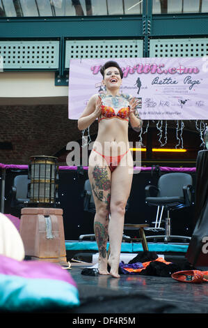 International burlesque performer Beatrix Von Bourbon entertains on the pin-up stage at the London Tattoo Convention 2013 Stock Photo