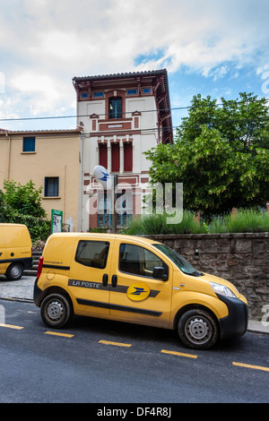 Parked La Poste delivery vans outside the Post Office in Arles-sur-tech, Languedoc-Roussillon, France. Stock Photo
