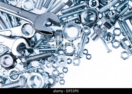 Wrenches, nuts and bolts on plain background Stock Photo