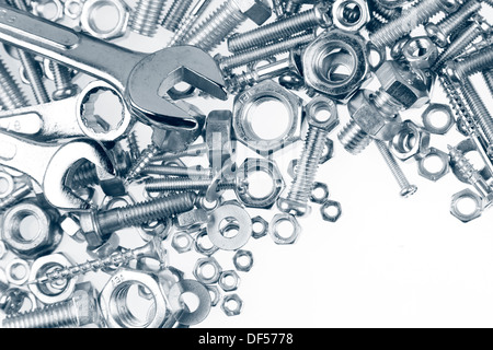 Wrenches, nuts and bolts on plain background Stock Photo