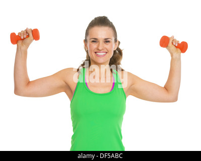 Happy fitness young woman making exercise with dumbbells Stock Photo