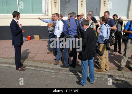 Photographers negotiating with security staff about where they can stand - Labour Party Conference, Brighton, 2013 Stock Photo