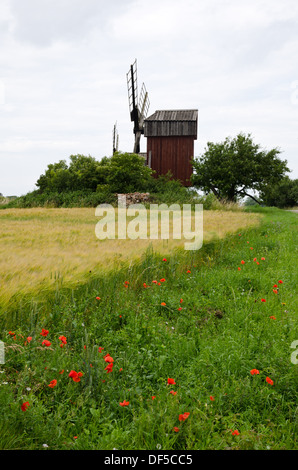 Road-side with poppies and windmill Stock Photo