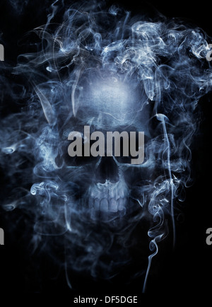 Photo montage of a human skull surrounded by cigarette smoke. Stock Photo