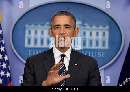 Washington DC, USA. 27th Sep, 2013. United States President Barack Obama delivers a statement on the budget, a possible US government shutdown, foreign policy and the situation in Iran, at the White House in Washington DC, USA, 27 September 2013. Photo: Michael Reynolds/dpa/Alamy Live News Stock Photo