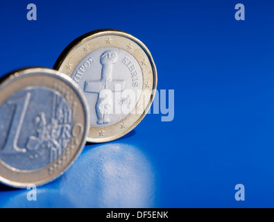 Euro coins from Cyprus on blue background. Stock Photo