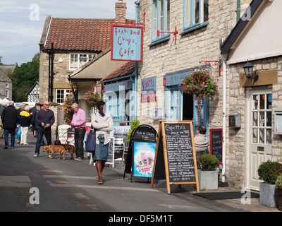 Tourists in Borogate a pedestrianised shopping street in the Market Town of Helmsley North Yorkshire UK Stock Photo