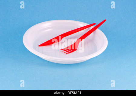 plastic disposable tableware for picnic on azure background Stock Photo