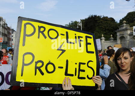 Dublin, Ireland. 28th September 2013. A protester holds a sign that reads 'Pro-life - pro-lies'.Pro-Choice activists marched through Dublin, calling for a new referendum on abortion, to allow abortion in Ireland for all women. The protest march was part of the Global Day of Action for Safe and Legal Abortion, which is held across the world. Credit:  Michael Debets/Alamy Live News