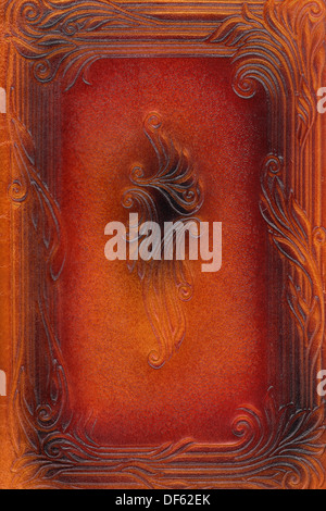 brown and red leathercraft tooled vintage book cover with texture and border Stock Photo