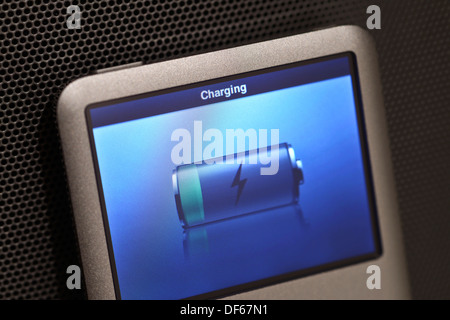 Empty Apple iPod battery being charged Stock Photo