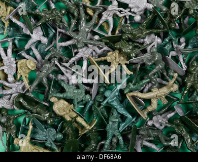 Jumble of green plastic toy soldiers Stock Photo