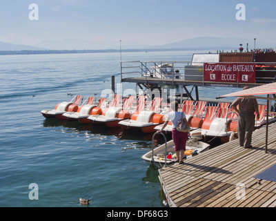 Nyon, a Swiss town on the shores of Lake Geneva in Switzerland,  pedal boats waiting for tourists Stock Photo