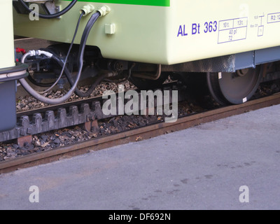 Aigle Leysin railway in the Vaud canton of Switzerland, close up of track cog-wheel railway,  and railcar coupling Stock Photo