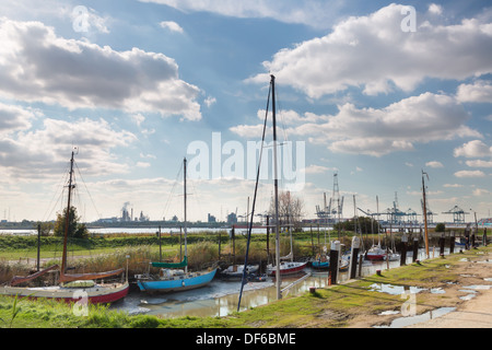 View from the abandoned little village of Lillo on the busy port of Antwerp on the other side of the river Scheldt Stock Photo