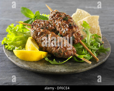 Kofte Kebab with salad & lemnon wedges Stock Photo