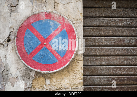 Weathered No Stopping sign in a Valletta back street, Malta Stock Photo