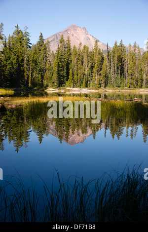 Four Mile Lake shows a nearly perfect reflection for Mt McLoughlin Stock Photo