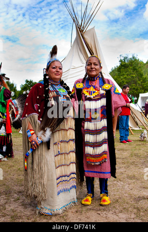 Native American Indian woman in front of Tipi Tepee Stock Photo