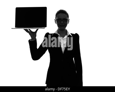 one  business woman holding showing computer laptop in silhouette on white background Stock Photo