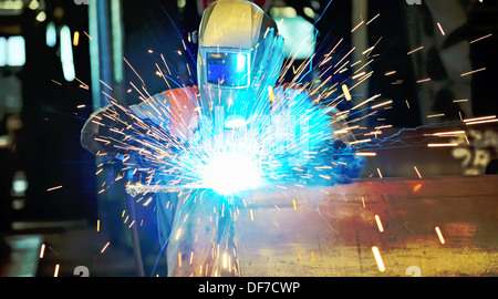 Welder work inside of plant Stock Photo