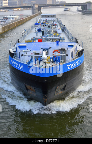 River Meuse Maastricht City bow view looking down from above on long large supply chain Dutch commercial motor barge Limburg Netherlands Europe Stock Photo