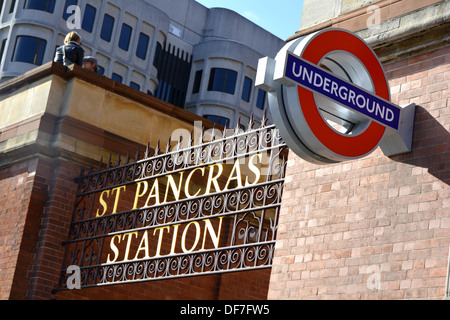 Signs for St Pancras mainline railway station with London Underground sign adjacent Stock Photo