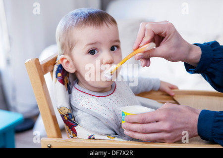 CHILD EATING A MEAL Stock Photo