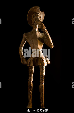 Old Wooden Knight Don Quijote de la Mancha on black background. Stock Photo