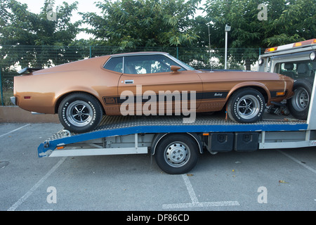 1970's brown  ford mustang mach 1 recovery truck Stock Photo