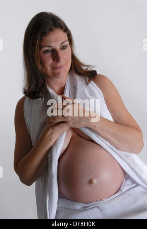 Woman pregnant with twins Stock Photo