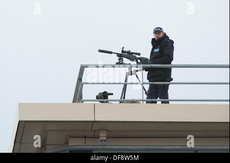 Manchester, UK. 30th Sept, 2013. A police 'sniper' positioned on the roof of the Premier Inn hotel on Lower Mosley Street opposite the Manchester Central exhibition centre observes the streets below. The exhibition centre was hosting the Conservative Party Conference in September 2013. Credit:  Russell Hart/Alamy Live News. Stock Photo