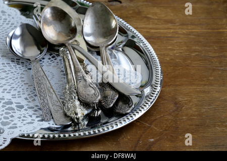 vintage cutlery with old-fashioned napkin on a silver tray Stock Photo