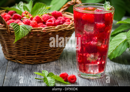 Juice of fresh raspberries served with ice in a glass Stock Photo