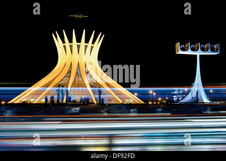 Brazil, Brasilia: Nocturnal illuminated cathedral with car traffic in foreground Stock Photo