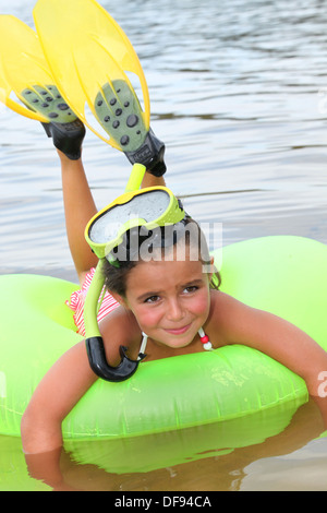 portrait of a little girl on a rubber ring Stock Photo