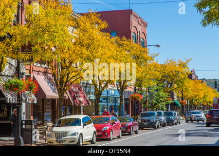 Yellow fall trees on Market Street in the historic Gaffer District of Corning New York Stock Photo