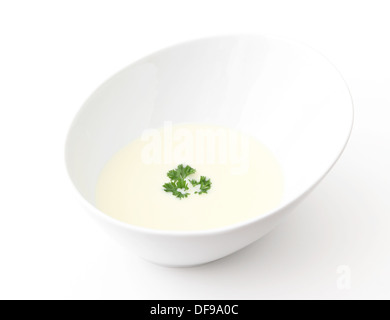 A bowl of cream of cauliflower soup isolated on a white background. Stock Photo