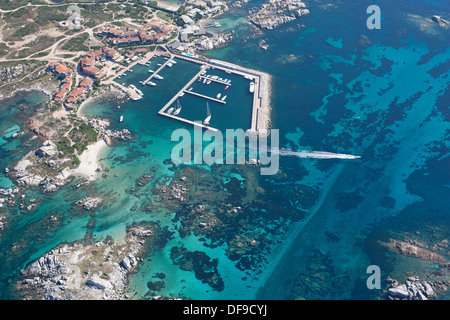 AERIAL VIEW. Small marina with a seabed displaying a stunning blue. Cavallo Island, Lavezzi Archipelago, Bonifacio, Corsica, France.