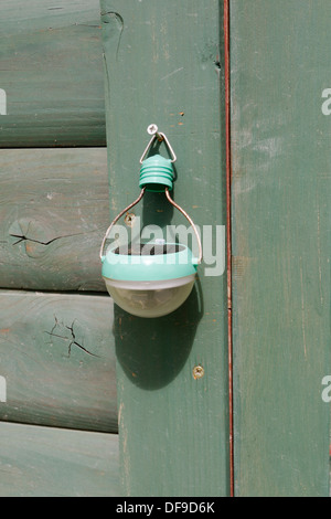 Solar powered outdoor LED light, charging in sunshine, Wales, UK Stock Photo