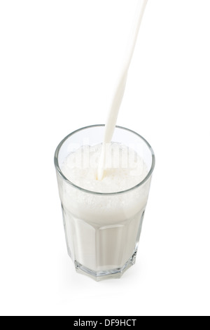 Pouring milk in a glass isolated on white Stock Photo