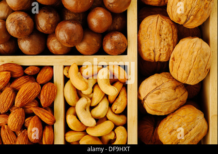 Assorted nuts in wooden box Stock Photo
