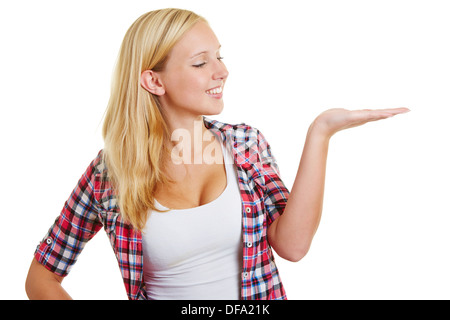 Smiling happy woman with open palm of her hand Stock Photo