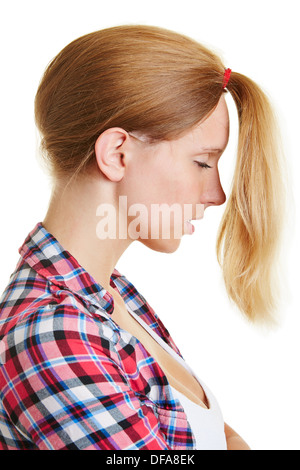Blond young woman wearing her hair to a ponytail to the front Stock Photo