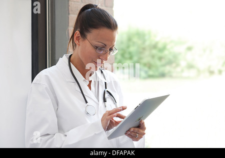 female doctor using ipad tablet computer Stock Photo