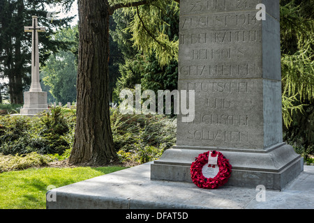 WWI German stele and British Cross of Sacrifice at the St Symphorien cemetery at Saint-Symphorien near Mons, Belgium Stock Photo