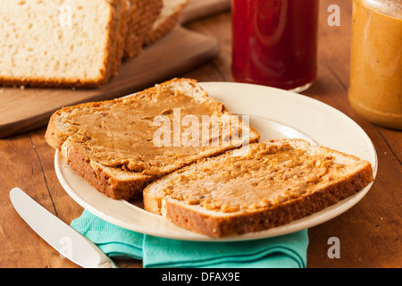 Homemade Chunky Peanut Butter Sandwich on Whole Wheat Bread Stock Photo